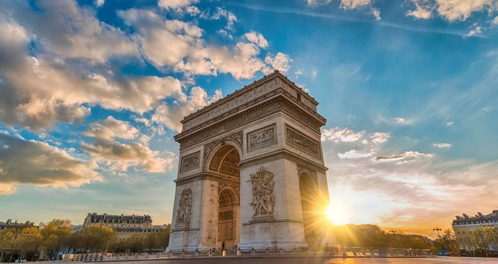Paris France sunset city skyline at Arc de Triomphe and Champs Elysees