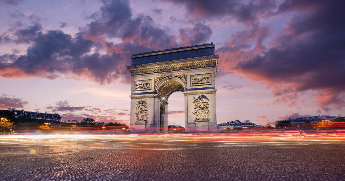 Arc de Triomphe(Arch of Triumph) Paris city at sunset. Long exposure panorama