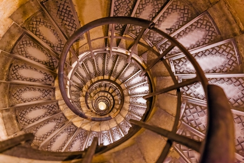 Spiral stairs inside Arc de triomphe in Paris France - travel and architecture background