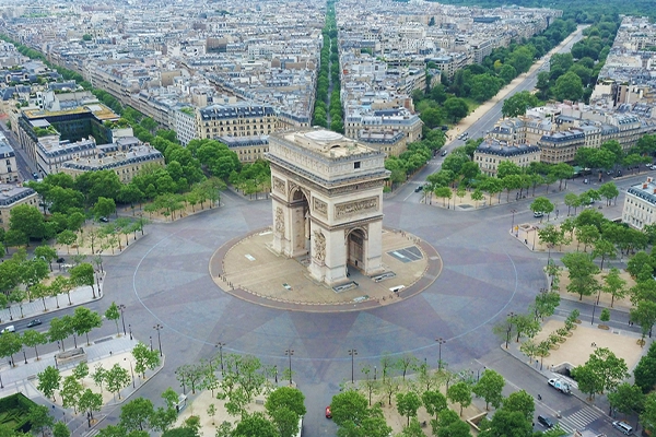 World famous Arc de Triomphe at the city center of Paris, France. Sky view