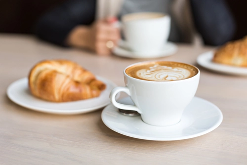 delicious coffee with croissant