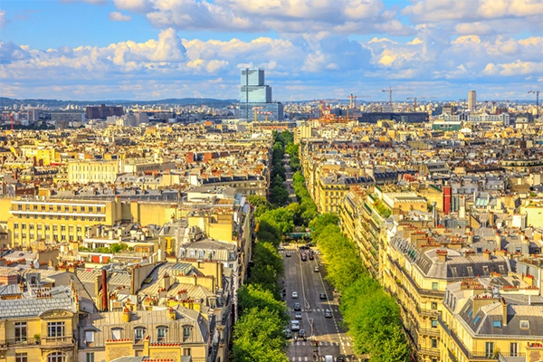 Aerial view of Paris skyline from Arc de Triomphe in a beautiful sunny day with blue sky. Avenue de Wagram from Triumphal Arch. Paris Capital of France in Europe. Scenic urban cityscape.