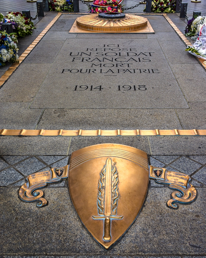 Arc de Triomphe de l'Etoile on Charles de Gaulle Place, Paris, France. Tomb of the Unknown Soldier beneath the Arc. Arc is one of the most famous monuments in Paris.